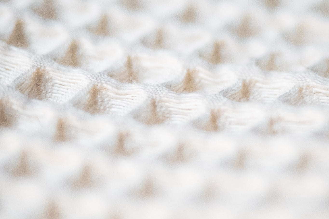 Close-up of the open waffle weave on a Cult of Sauna cotton sauna towel