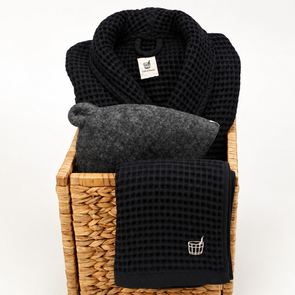 The Ritual Set sauna gift set in Aurora: The Sauna Robe, Hat and Towel in a woven gift basket
